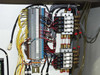 BF-200 interior pneumatic and electrical panel detail – numbered terminal strip, solenoid valve manifold bank with brass fittings, and bundled multi-color wiring