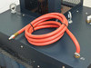 Hitran AT0098-01 — top panel showing coiled red coolant hose with brass fitting and hose clamp attachment points