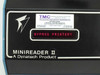 Close-up of Dynatech Minireader II front panel LED display showing BYPASS PRINTER message and TMC reconditioned label