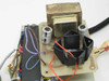 Close-up of internal control board showing power transformer with corrosion, capacitors, relay, and multi-color wiring — detail view