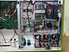 GreenVolts GV-SCP001 – right lower internal section showing contactors, PULS power supplies, terminal blocks, and wiring