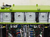 GreenVolts GV-SCP001 – top of cabinet showing four Powertronix 3-phase choke units each labeled PASSED, with GPS antenna and input connectors