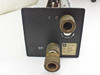 Spectra-Physics 2210 power supply — front face plate closeup showing two brass water quick-disconnect fittings and WATER INLET label