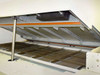 Vitronics ISO5006 reflow oven — interior view showing upper heating zone panels, orange heating elements, and wire mesh conveyor belt