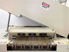Vitronics ISO5006 exit end view — hood propped open showing cooling fans and wire mesh conveyor belt exiting the oven, DANGER HOT label visible