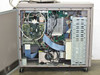Interior view with side panel open – multiple populated expansion cards, motherboard, internal power supply, ribbon cables, and wiring harnesses