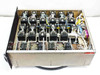 Interior top-down view of the carrier kill switch chassis showing approximately 20 Trans-Tel TRMS50M RF coaxial switch modules arranged in rows with white ribbon cable wiring harnesses