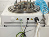 Front lower section of Auto 500 chamber unit showing electrical connection ports, ground wire (green/yellow), and warning labels