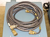 Large multi-pin military circular connector cable coiled on top of Tektronix 1140A unit — heavy-duty system interconnect cable with mil-spec connectors on both ends
