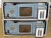 Rear panel view of two stacked Tektronix 1140A Programmable Power Supply units — showing large military circular output connectors, BNC ports, Centronics interface connectors, cooling vents, and attached Program Unit modules