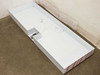 Compression Polymers drip tray showing internal pneumatic tubing and foot pedal assembly routed across tray floor