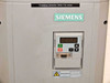 Siemens Midimaster Eco front panel close-up showing 4-digit LED display, start/stop buttons, DB9 serial port, and boiler fan motor label
