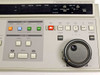 JVC RM-G800U – close-up of right half of front panel showing REC, REW, PLAY, STILL, FF, SEARCH buttons, jog/shuttle dial, and timecode display area