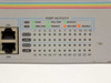 Allied Telesyn AT-8324SX front panel Port Activity LED array for all 24 ports with MODE and LINK indicators labeled Flow, Full Dup, Activity, 100M Link, Disable, 10M Link