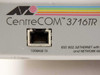 Allied Telesyn CentreCOM 3716TR label closeup showing 100BASE-TX uplink RJ-45 port on front panel