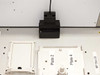 Close-up of BioRobot 8000 black optical barcode or plate sensor module mounted above Plate 2 and Plate 4 deck positions