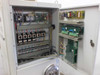 High Point dryer loader — electrical cabinet interior showing terminal blocks, contactor bank, relay modules, and control circuit boards