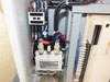 Interior view showing Mitsubishi US-K40SS solid state contactor and additional wiring and terminal block components inside the cabinet