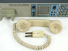 PADS Series 100 Voice Terminal handset detail — cream-colored telephone handset with coiled cord and dual-banana plug connector shown next to front panel