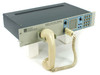 PADS Development Labs 2000082-100 Series 100 Voice Terminal front three-quarter view with telephone handset resting in cradle holder
