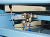 Pneumatic air manifold and brass fittings on underframe showing blue air lines and distribution block