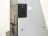 Spindle lock panel on optical column side showing labeled SPINDLE LOCK plate and locking mechanism