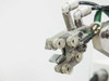 Sailor OE-2413 sprue gripper head — close-up of gripper jaw mechanism with suction cups, side angle