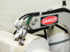 Sailor OE-2406 suction grabber head detail showing DANGER label, pneumatic quick-connect fittings, brass barb fittings, and suction cup mounts
