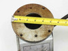 Top flange of three-way gate valve measured with tape measure showing approximately 7-inch flange diameter and 4-inch bore