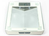 Insight 1380 scale top view showing large glass platform, embedded V-shaped mirrors, LCD display reading 0.0 lb, and illuminated cue light button