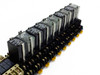 Omron G3FM-2R5 and G6B-1114P relay assembly on DIN rail – side angle view showing full row of relays in sockets