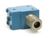 RF Coax Isolator 27338 – front-facing view of large threaded SMA input/output port
