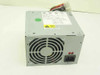 IBM 12J5991 API-6056 90W desktop power supply – rear view showing 80mm cooling fan and IEC AC input connector with red voltage selector switch