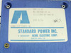 Standard Power SPS 15-15 rating label — shows model SPS 15-15, part number 01-301568-00 A1, 115/230V 47-440Hz, 15V 0.7A, Standard Power Inc. subsidiary of Acme Electric Corp.