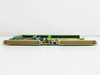 Netstal DIO 110.240.9216a Komplett board — profile/edge view showing board thickness, edge connector fingers, and component height