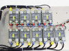 Crydom H12WD4850-5727 SSR labels — close-up showing model number markings on individual relays with red, blue, and yellow terminal wires