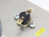 Thermostat thermal cutout device mounted on stainless steel heatsink surface — close-up detail
