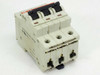 ABB S283-K10W circuit breaker — three-quarter front view showing red trip indicators and handle in ON position