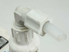 Little Giant VCC-20ULS discharge fitting close-up — white PVC 90-degree elbow and barbed outlet fitting showing normal use grime and wear