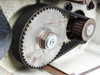 TC47 drive train close-up — large main drive sprocket and toothed timing belt detail