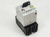 Eaton Moeller ZM-40-PKZ2 PKZ2 motor protective circuit breaker — front-left view showing rotary handle, red magnetic trip indicator, yellow thermal dial, and black terminal block base