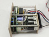Rear three-quarter internal view of Croyden 960-2 Rinse Controller chassis showing transformer, capacitors, PCB, and multi-conductor wiring harness