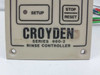 Close-up of Croyden Series 960-2 Rinse Controller nameplate showing brand name, series number, and 'Rinse Controller' designation with Setup and Stop/Reset buttons