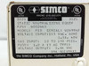 Simco F10 4002663 rating plate close-up — model F10, P/N 4002663, serial W269842, 115VAC 60Hz 0.3A 40W, gas input 10–100 PSIG, 5.8kV output