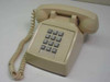 ITT Cortelco 250044-MBA-20M beige touchtone desk telephone – front three-quarter view showing handset and keypad