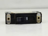 Heinemann AM1-A8-A circuit breaker – end view showing toggle switch in OFF position and panel mounting slots