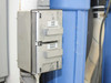 Chemical dosing relay box with Acid/Acid and Caustic/Caustic labeled channels mounted to side of system