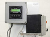 GF Signet pH/ORP controller close-up showing digital display and keypad with navigation buttons and ENTER key