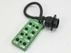Phoenix Contact SACB-8/16 sensor actuator connection box — top view showing 8 M12 sockets labeled MB1-1 through MB1-8 and attached multi-pin trunk connector with PUR cable