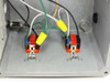 Interior view of enclosure base showing two wired 110V outlet receptacles with orange faces mounted on gray chassis